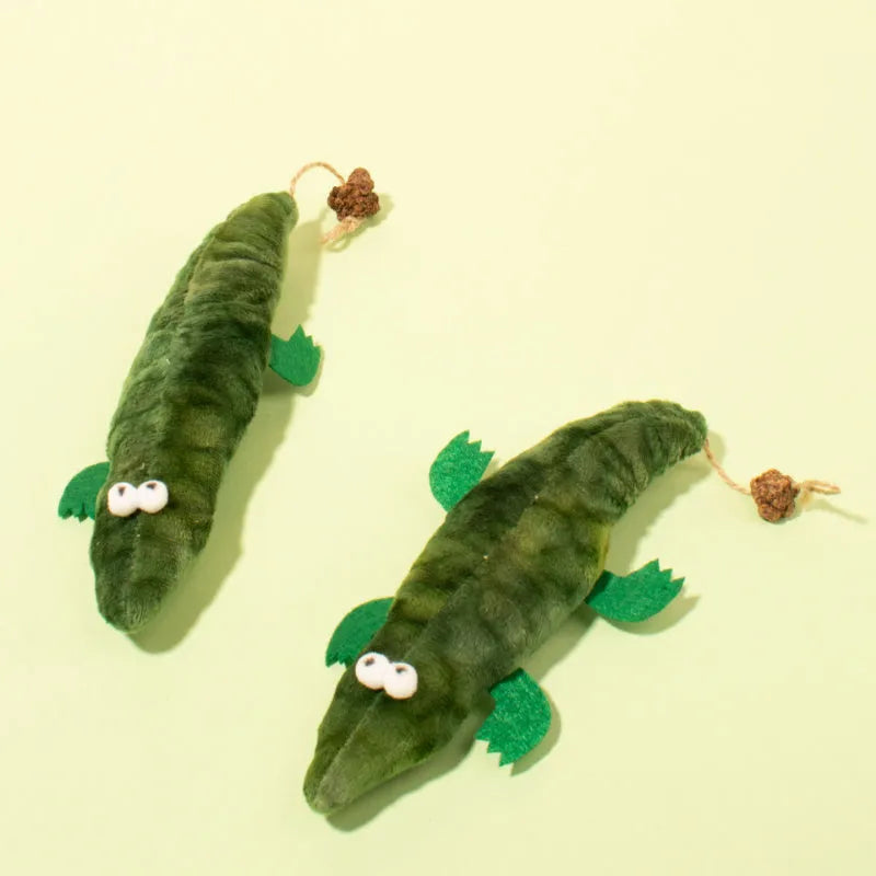 Green plush alligator cat toy with plant-based catnip and peppermint scent for oral cleansing