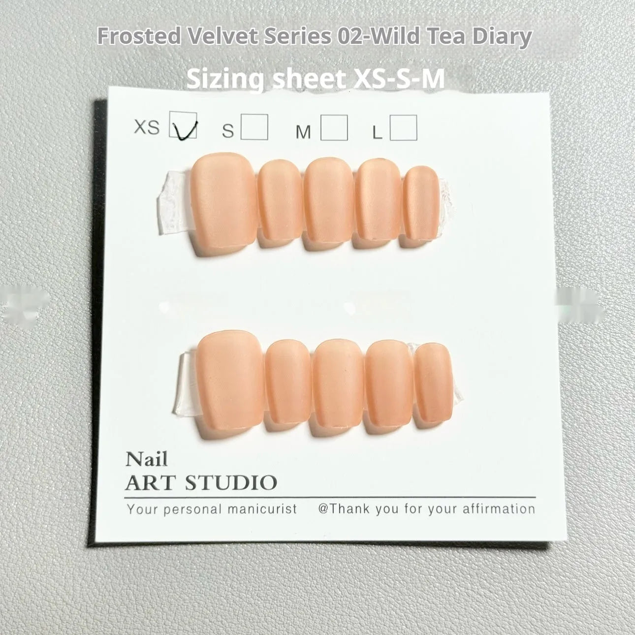Velvet frosted Cat's Eye artificial nails in short ladder sizes with Aurora armour designs
