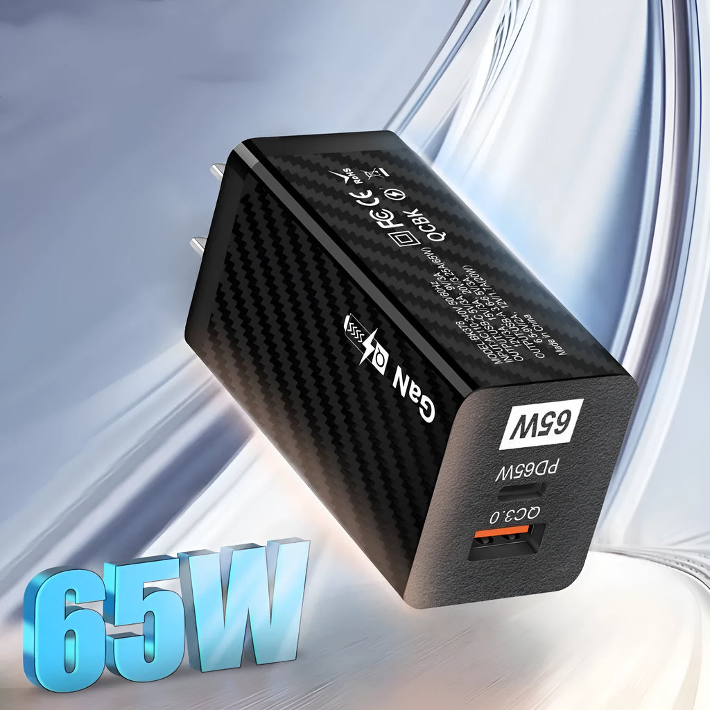 Black and white Gallium Nitride 65W USB-C laptop charger with EU, UK, and US plug options shown next to a laptop.