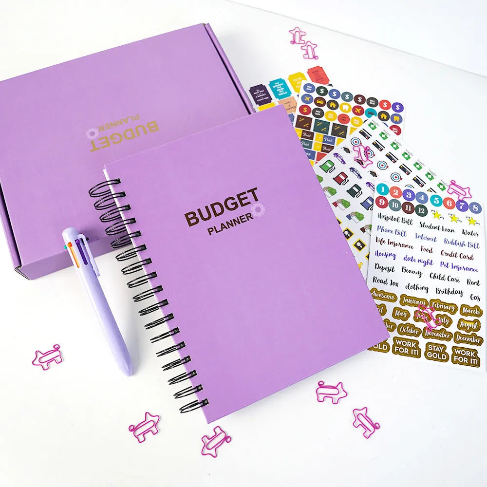 J12 purple coil-bound budget notebook with stickers and paper clips for financial planning