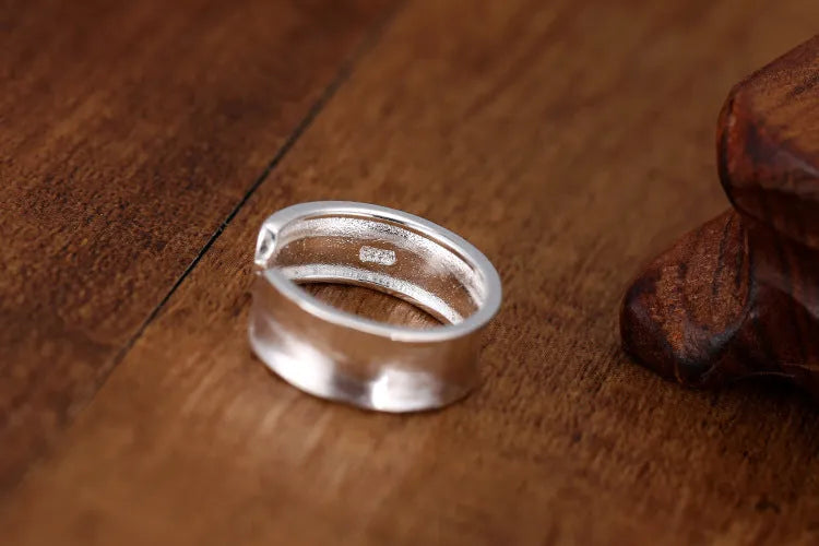 Geometric open ring with frosted silver finish and adjustable opening design