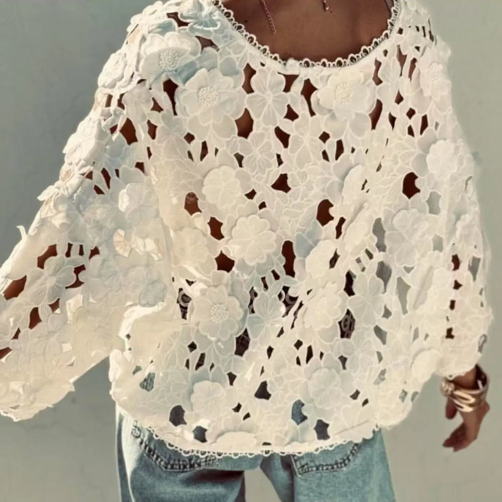 Women's loose black lace cardigan with three-dimensional white floral decoration and a V-neck.
