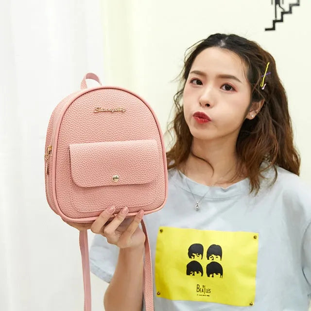Women's small PU shoulder backpack 18.5cm length in black, blue, grey, pink, or red with zipper closure