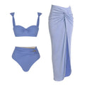 Women's solid colour one-piece swimsuit with matching skirt and gold button detailing