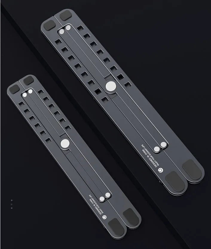 Portable foldable aluminum laptop stand shown in silver colour at an adjustable angle
