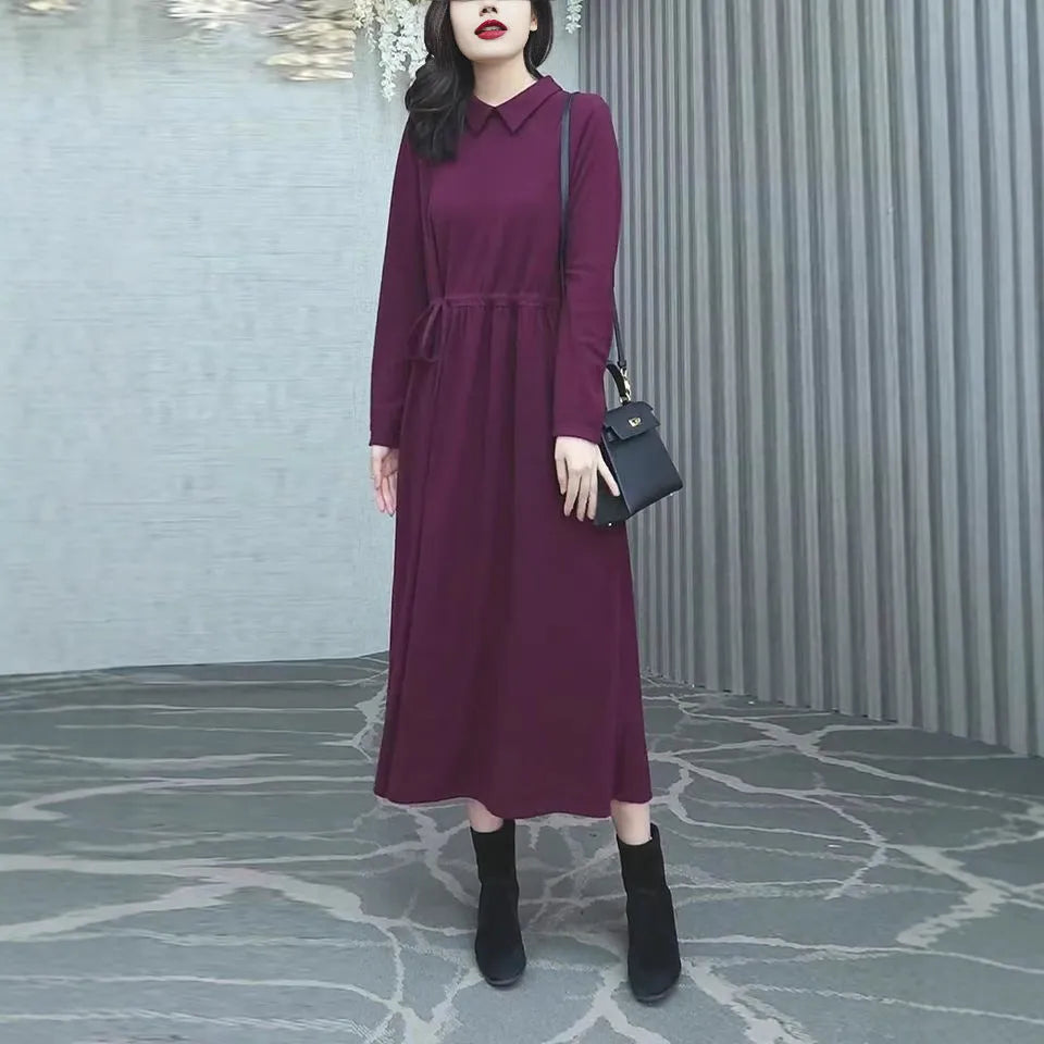 Purplish red plus size women's dress with extra long sleeves and a long skirt for autumn and winter office wear.