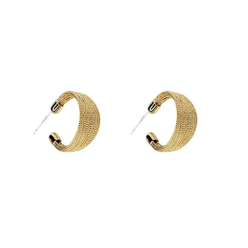Geometric multi-layer copper earrings with an electroplated silver or gold finish, shown as studs and clips.