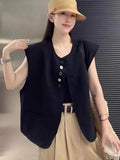 Women's loose fit vest in black with pocket detail and short length
