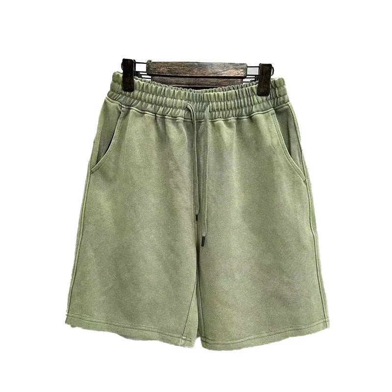 Men's loose fit distressed cotton shorts in straight leg cut with fifth pants length