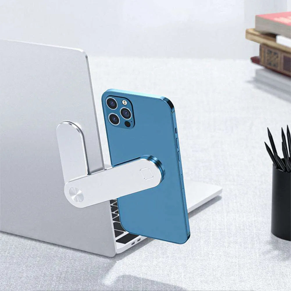 Black aluminium laptop phone holder with magnetic mount attached to laptop side