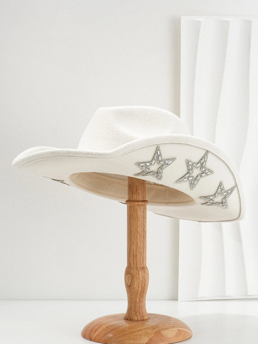 Polyester western top hat with conical crown and hexagonal star detail in size M.