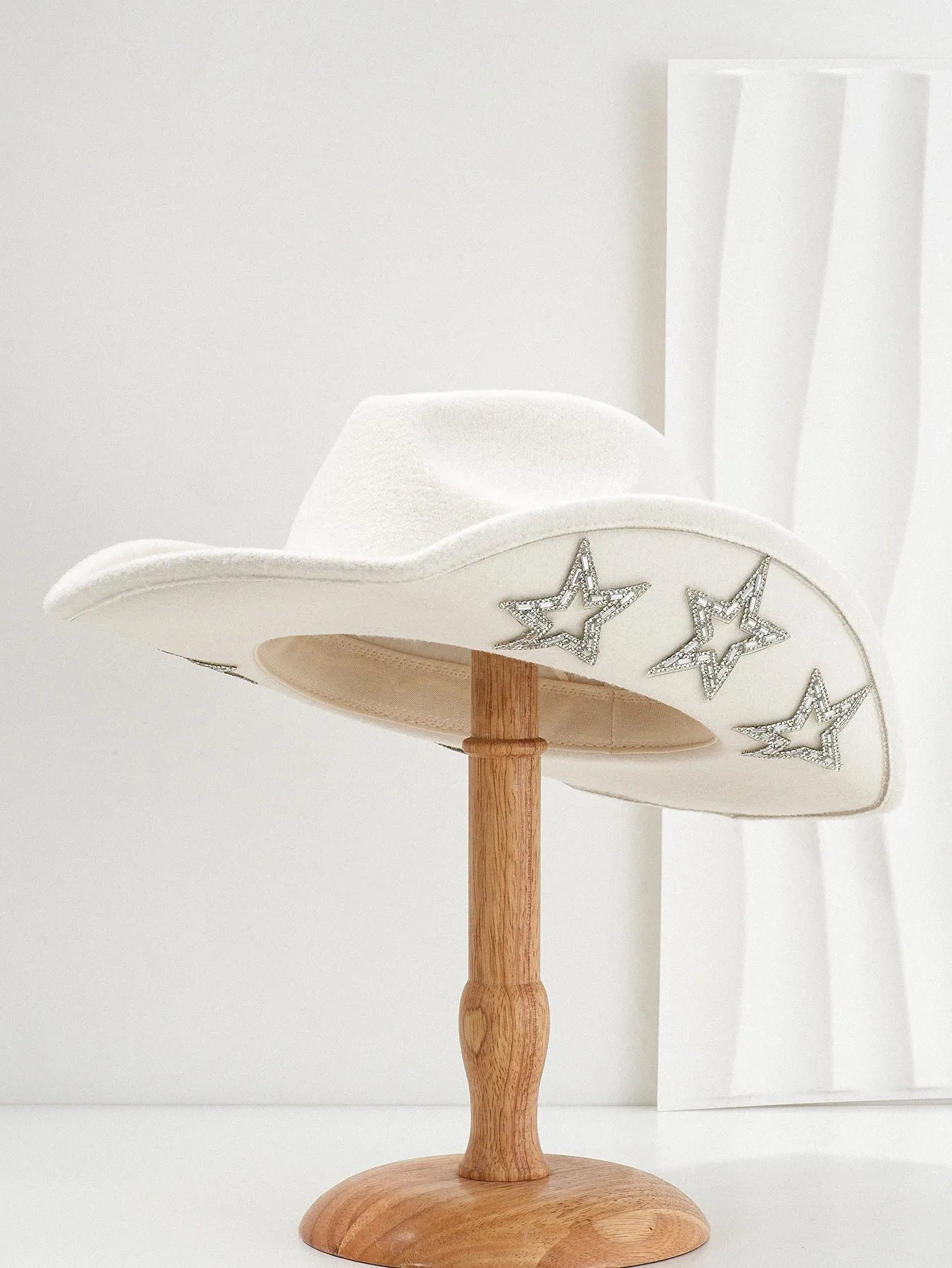 Polyester western top hat with conical crown and hexagonal star detail in size M.