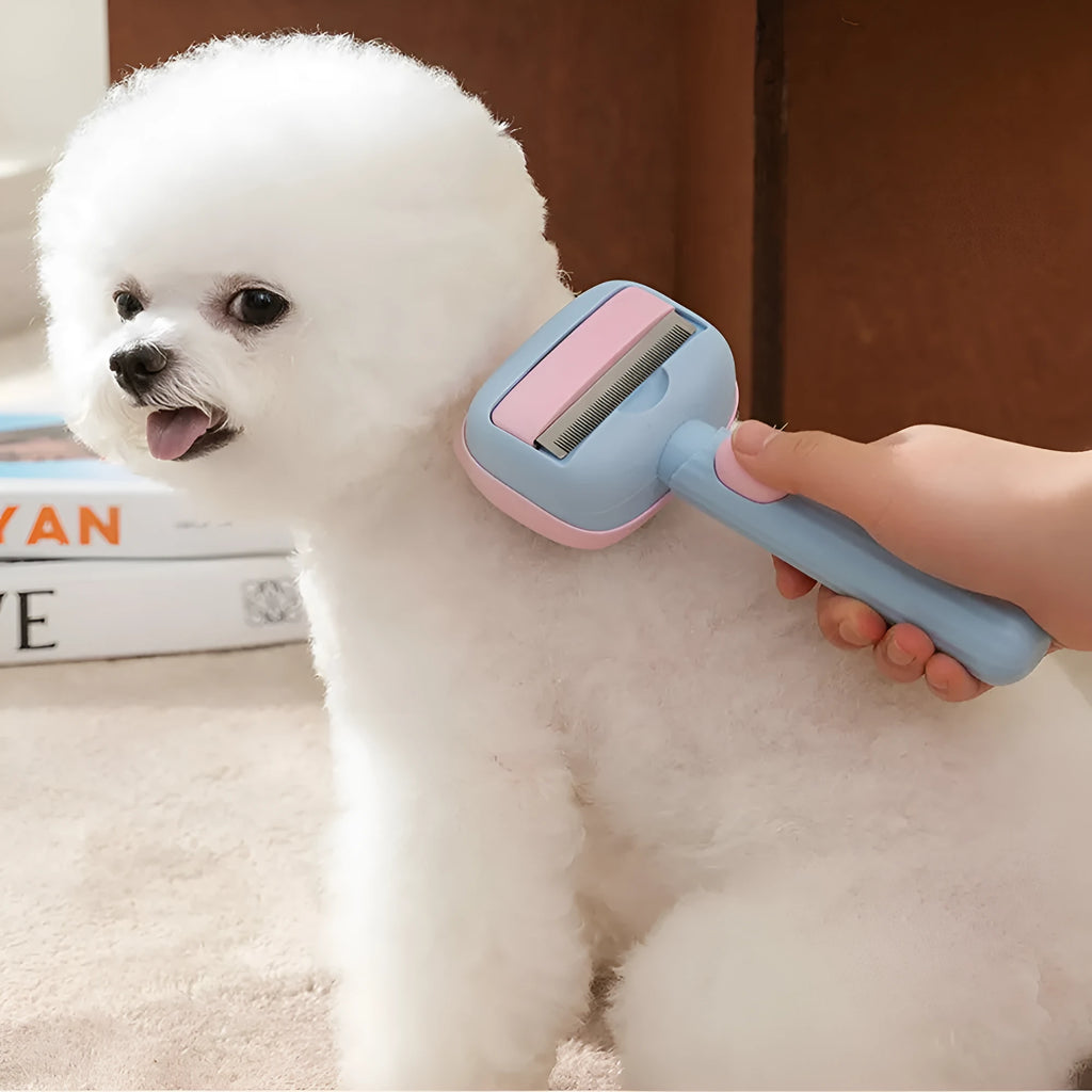Red double-sided pet grooming brush with de-shedding rake and de-matting comb on a white background