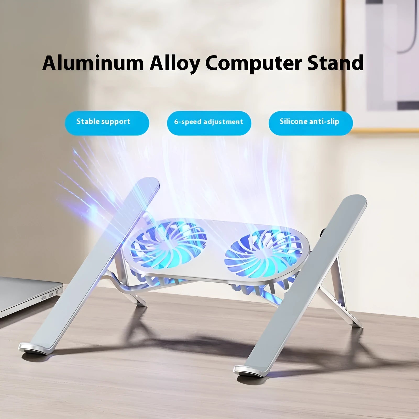 Aluminium alloy notebook stand with twin fans, silver finish, on a desk with a laptop placed on top