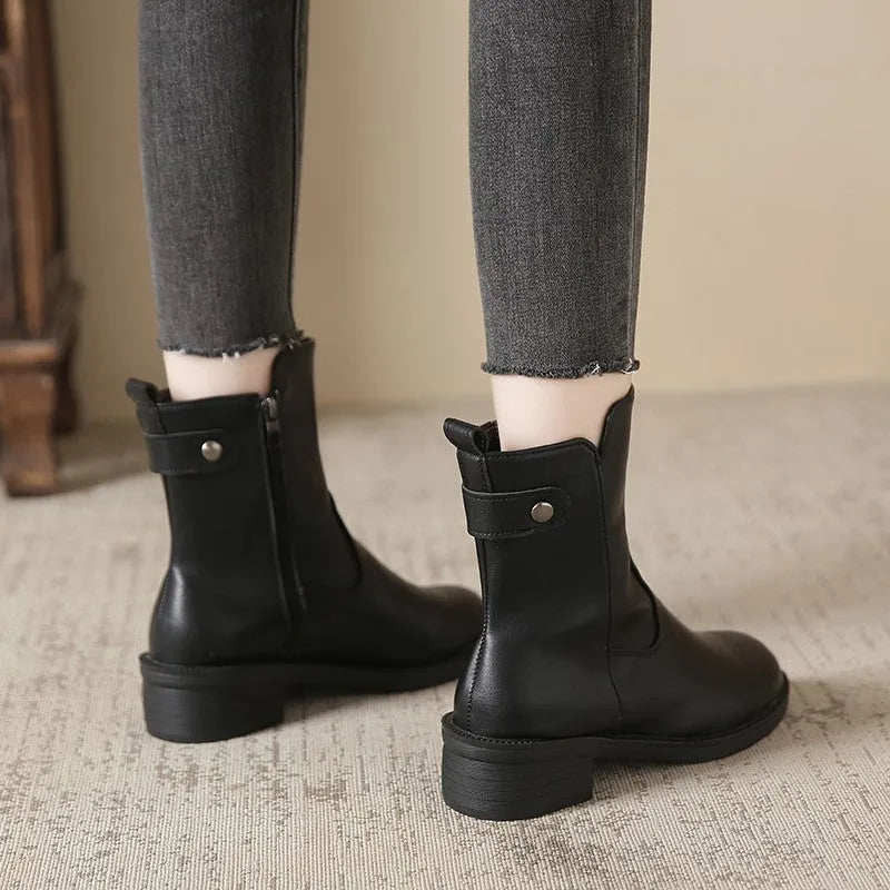Black women's low heel ankle boots with side zip fastening and round toe design