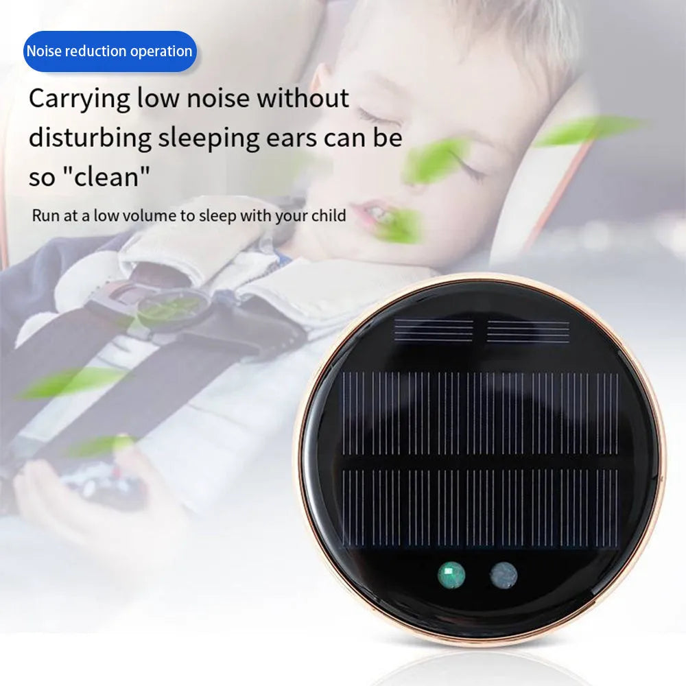 A black solar-powered car air humidifier mounted on a vehicle's air conditioning vent.