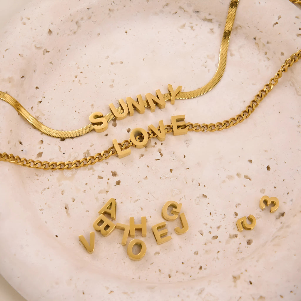 Gold electroplated titanium steel necklace with letter A charm on a 40.5cm blade chain