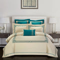 Four-piece cotton embroidery bedding set in Charcoal colour on a bed with neutral decor