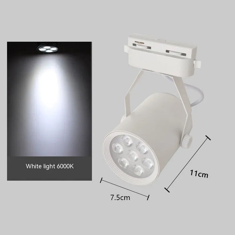 Black and white aluminium LED track spotlight on a lighting track for store display walls.