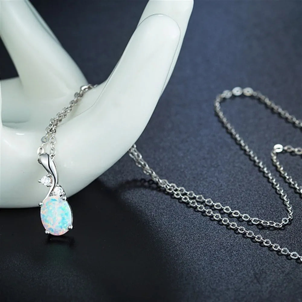 Water drop opal pendant necklace on an adjustable O-chain in rose gold or white.
