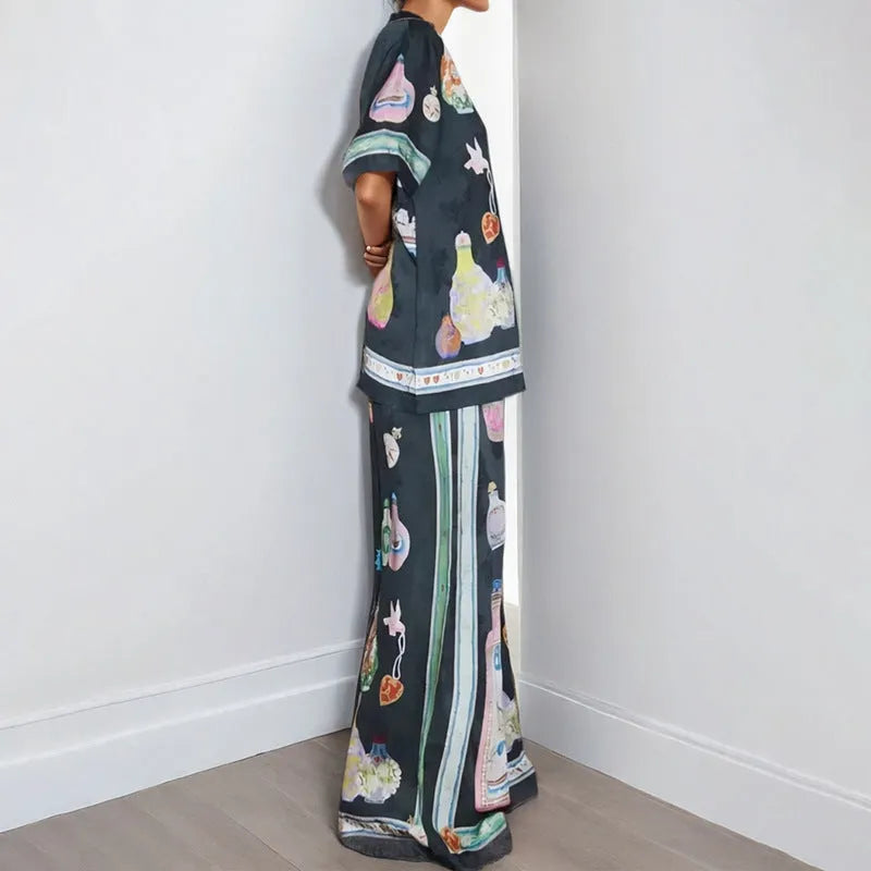 Black women's cartoon print polyester lounge set with cardigan sleeve top and matching trousers