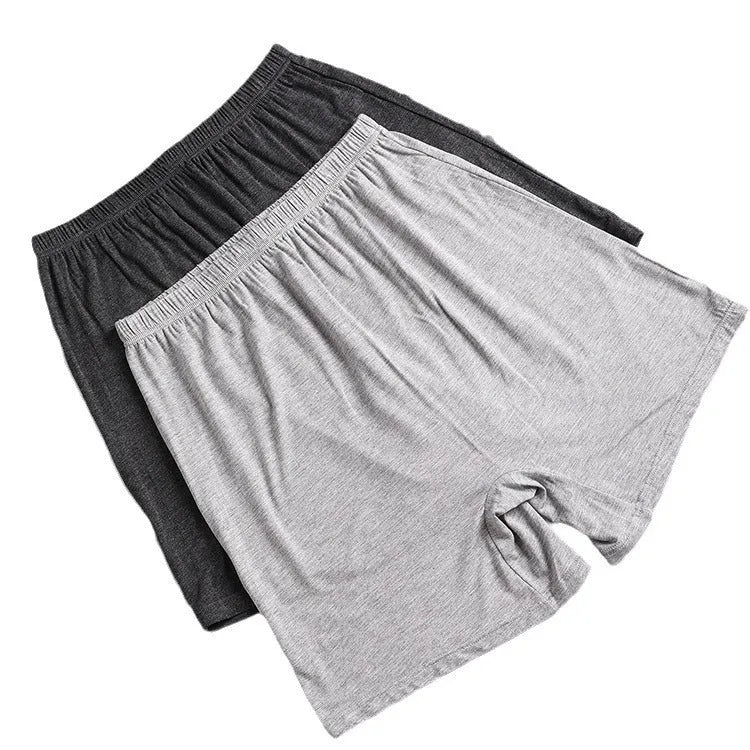 Men's solid colour modal boxer shorts in black, shown flat, highlighting the high-waisted design.