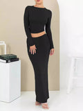 Women's autumn two-piece suit set showing top with three-quarter sleeves and matching long skirt