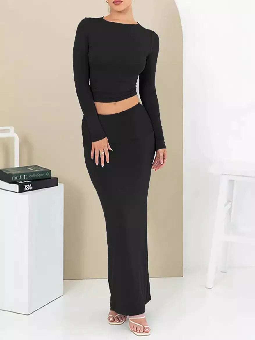 Women's autumn two-piece suit set showing top with three-quarter sleeves and matching long skirt