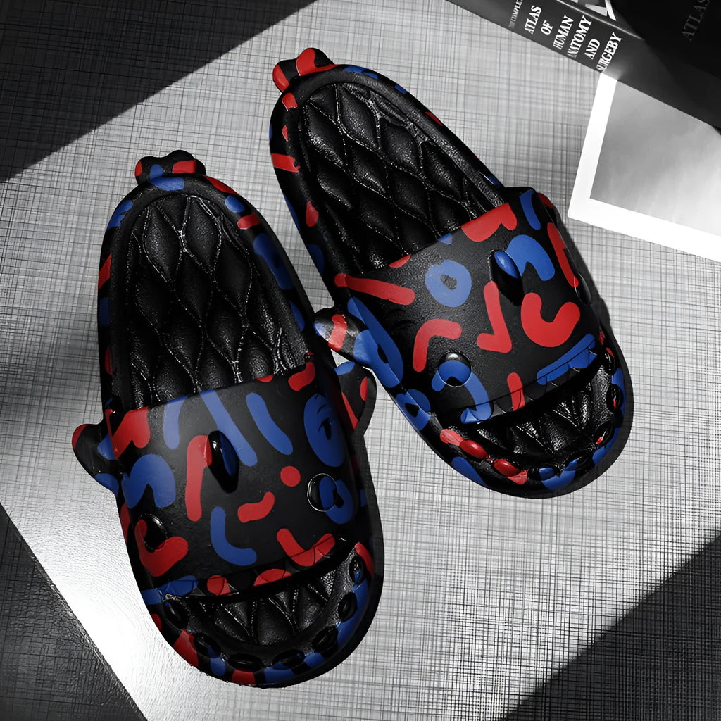 Shark couple design open-toe EVA home slippers on a plain background