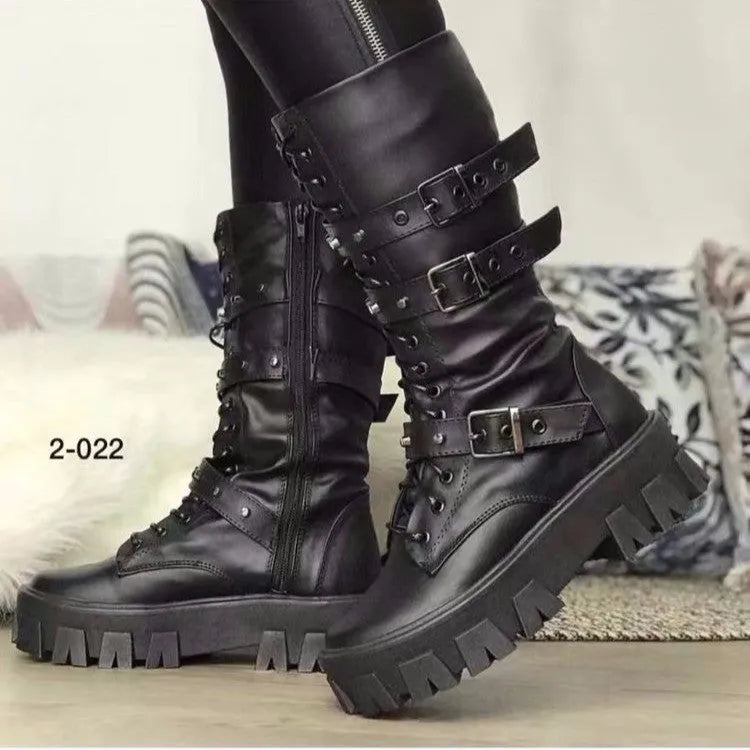 Black mid-calf women's boots with a prominent buckle detail and side zipper on a white background.