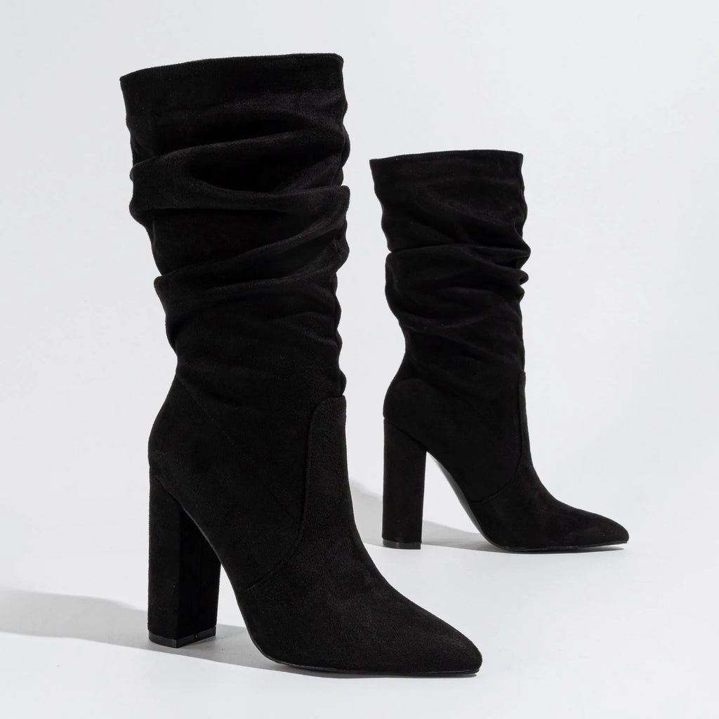 Women's black pointed-toe chunky heel ankle boots with suede upper and super high heel