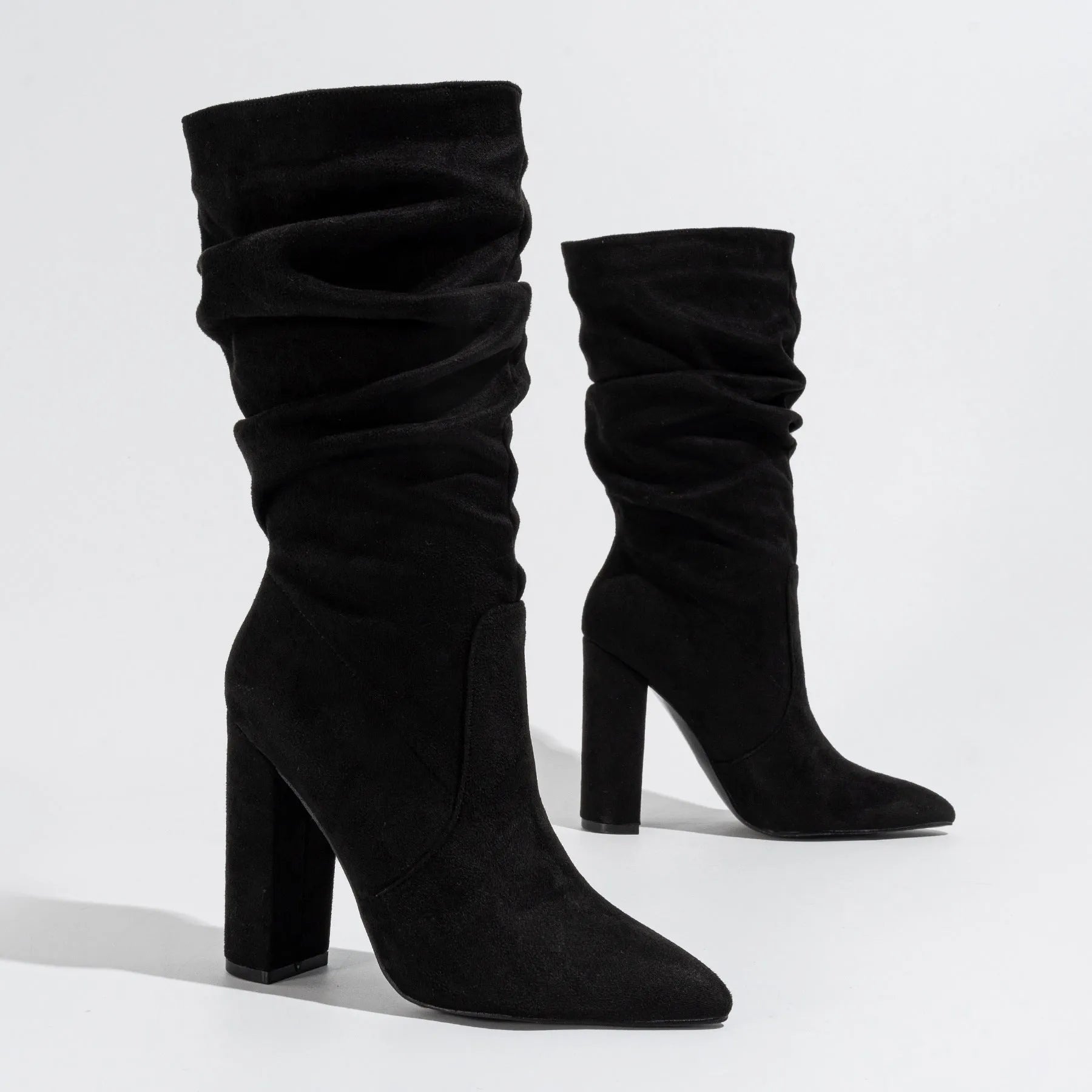 Women's black pointed-toe chunky heel ankle boots with suede upper and super high heel