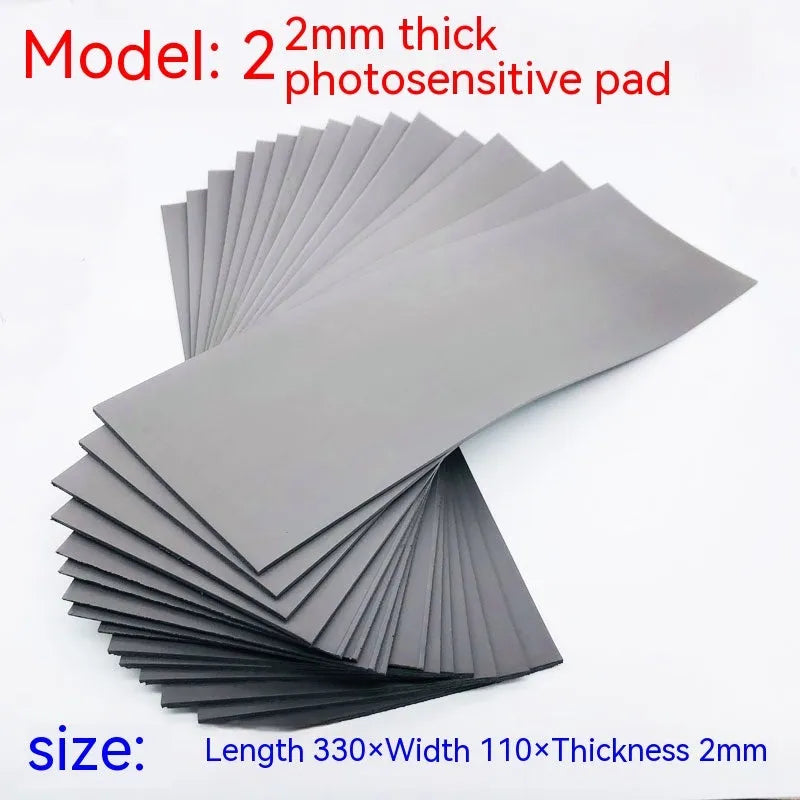 Black and grey plastic photosensitive seal mat measuring 330mm by 110mm.