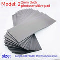 Black and grey plastic photosensitive seal mat measuring 330mm by 110mm.
