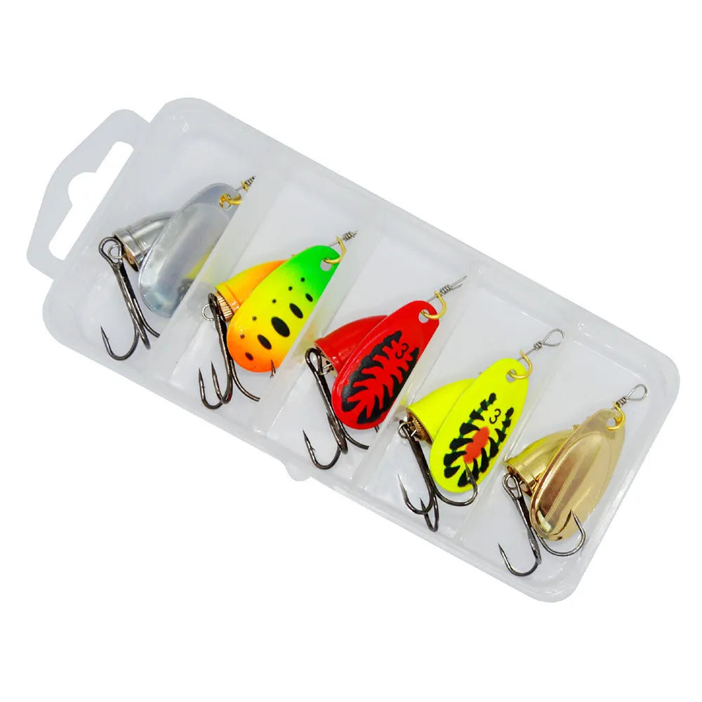 R-shaped metal fishing lure with rotating sequins and a central copper bell in multiple colour options.