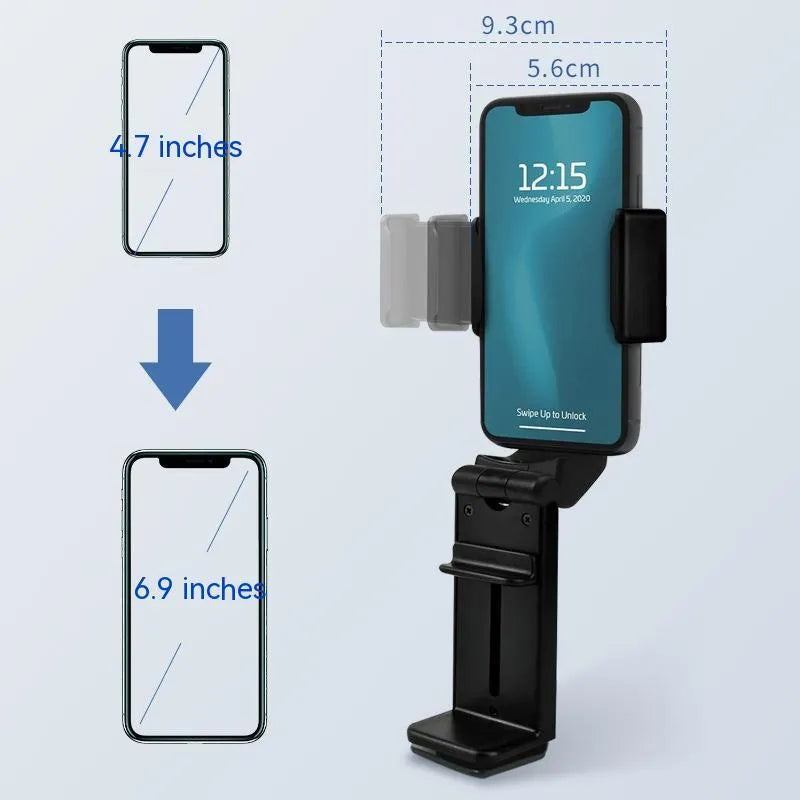 360 rotary collapsible mobile phone holder in black on a desk, with a phone propped up in landscape mode