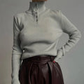 Women's silver grey slim fit pullover sweater with a single-breasted half turtleneck neckline detail.