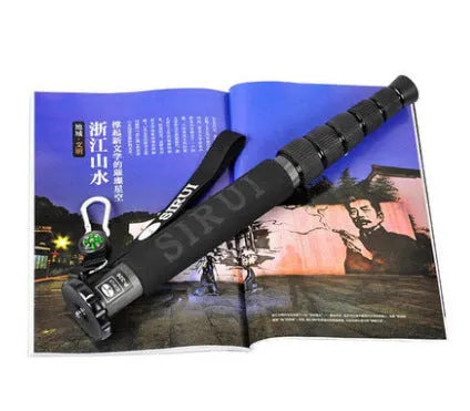 Black carbon fibre camera monopod extended to maximum 1540mm height with SLR camera mounted
