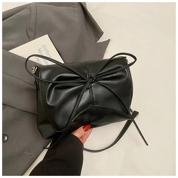 Women's horizontal square PU leather crossbody bag in black with sewing line detailing and mobile phone pocket
