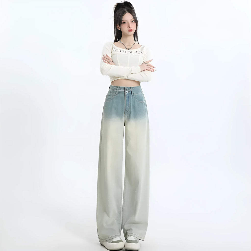 A pair of women's gradient blue straight-leg denim trousers with a wide leg opening, laid flat.