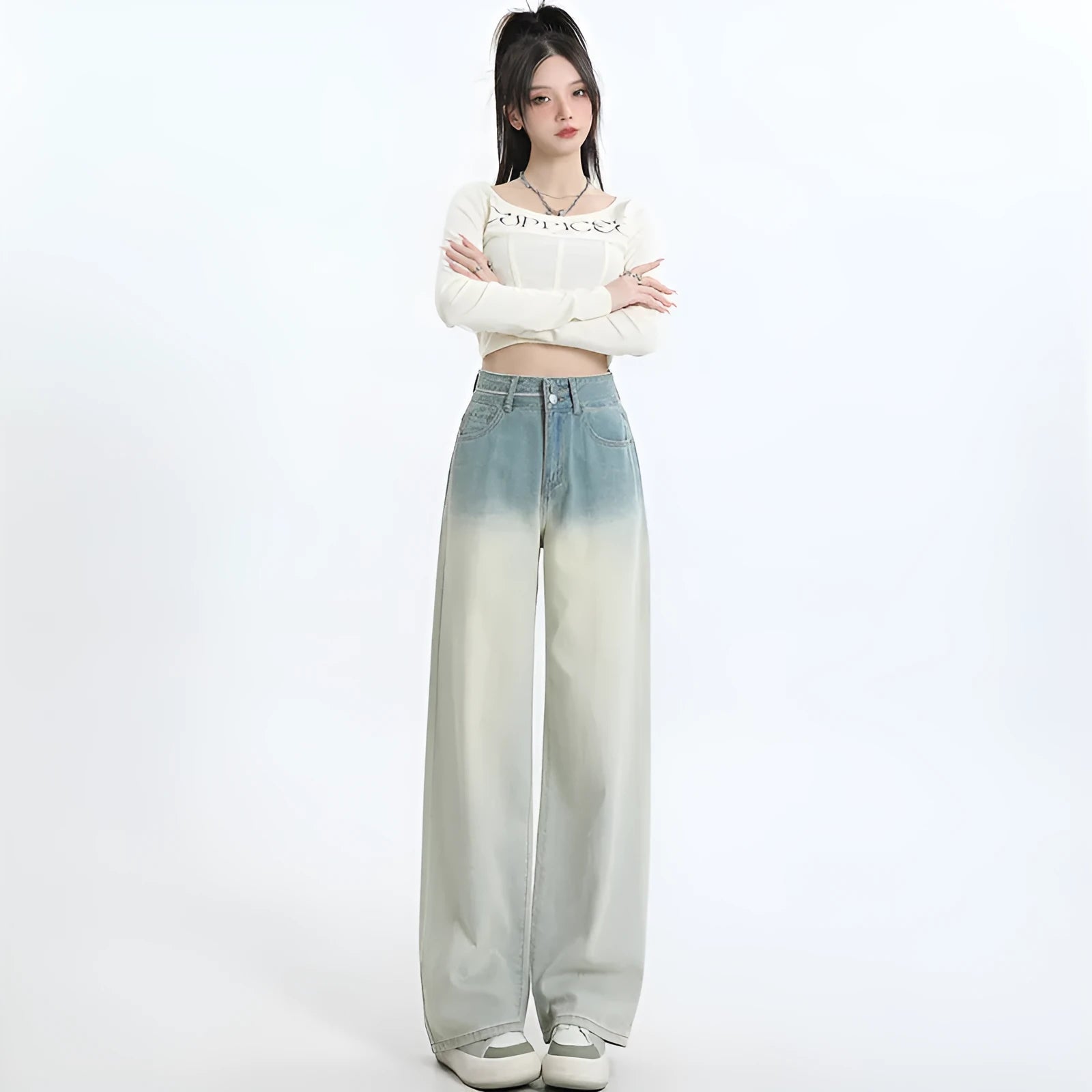 A pair of women's gradient blue straight-leg denim trousers with a wide leg opening, laid flat.