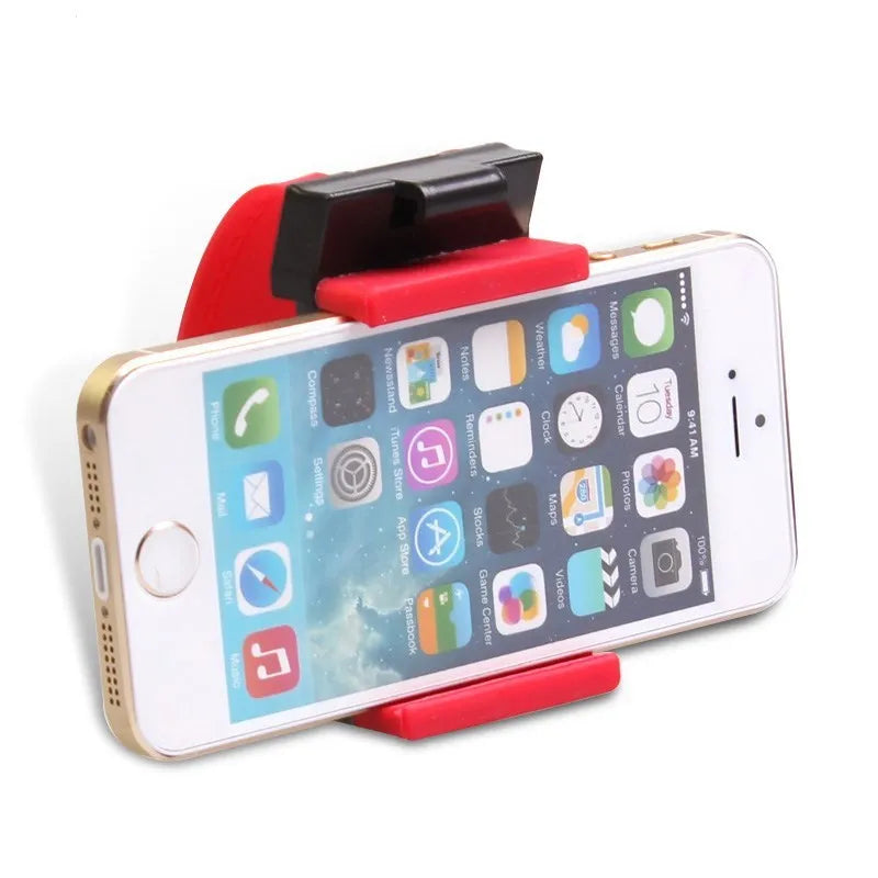 Black steering wheel phone clip holder mounted on car steering wheel