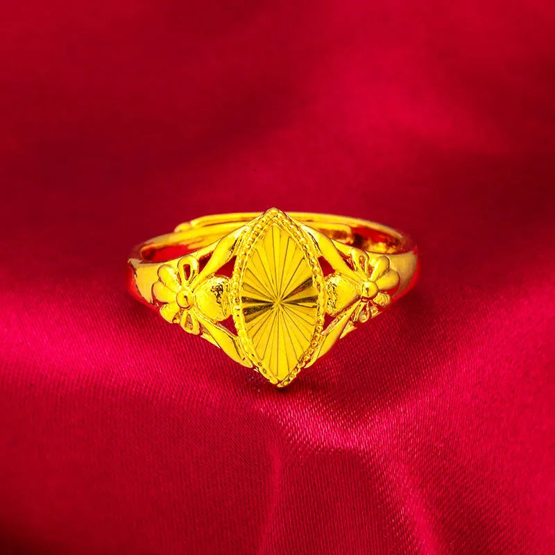 Gold coloured electroplated brass ring with open diamond flower geometry design and texture details