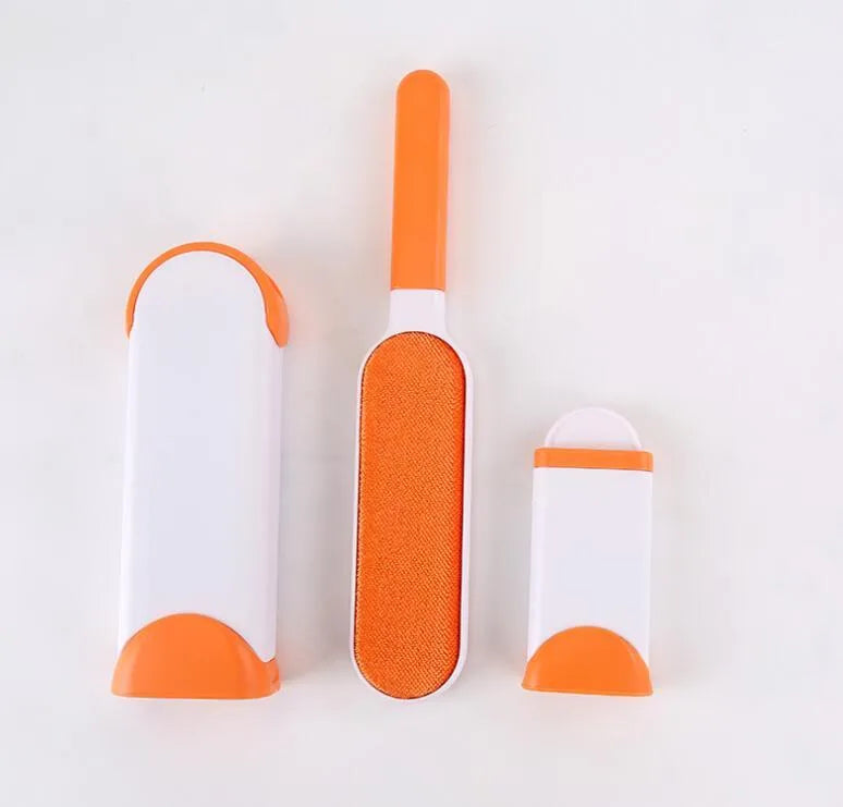 Blue self-cleaning pet hair removal brush for sofas on a grey fabric couch.