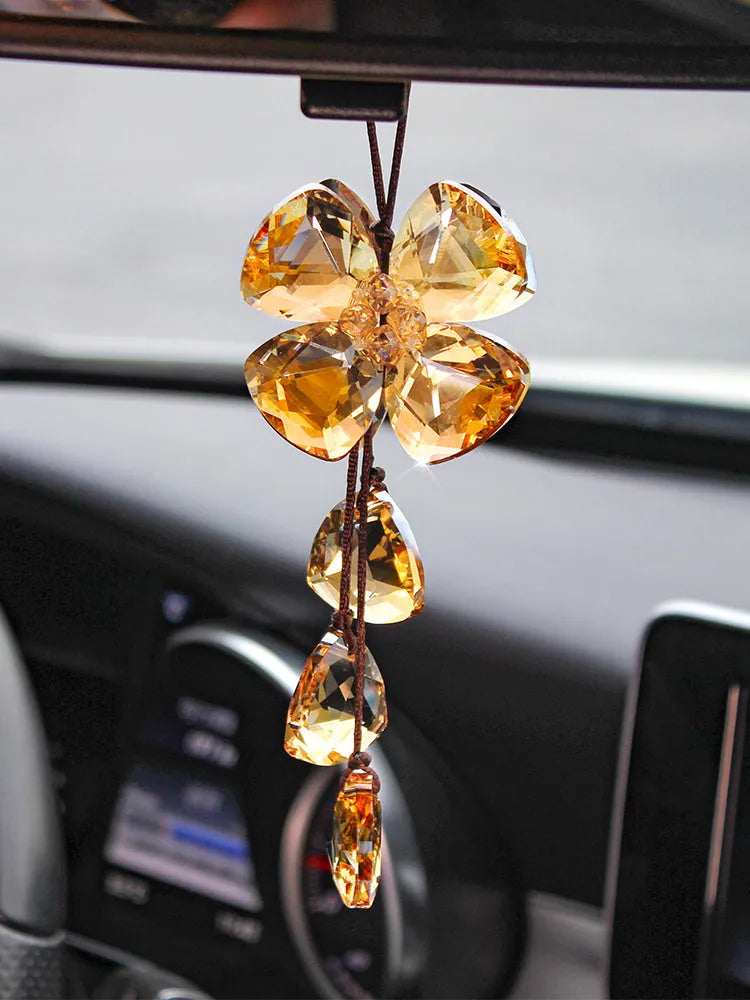 Crystal four leaf grass car pendant measuring around 20cm in transparent, champagne, translucent black finishes