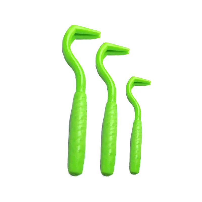 Three plastic tick removal hooks in different colours for pet parasite control