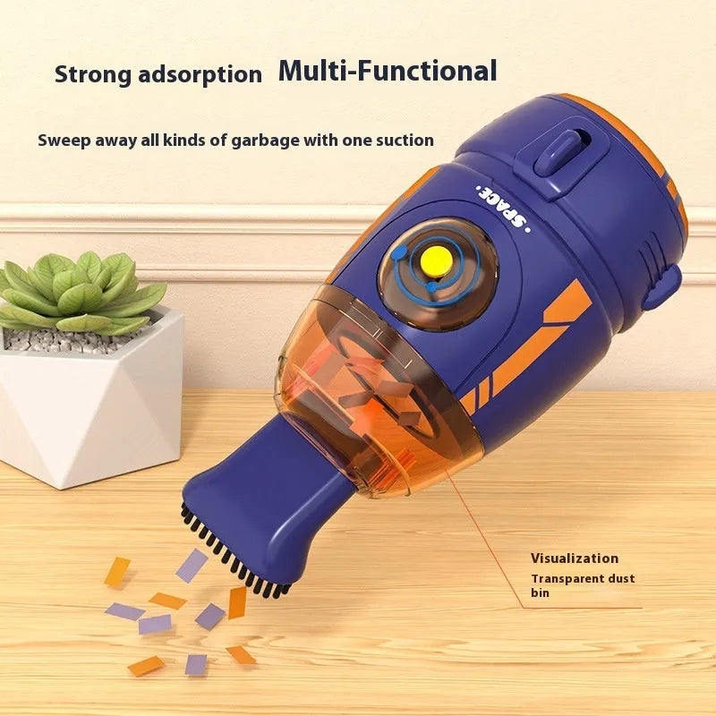 Blue USB rechargeable handheld desktop vacuum cleaner on a wooden desk next to a keyboard.