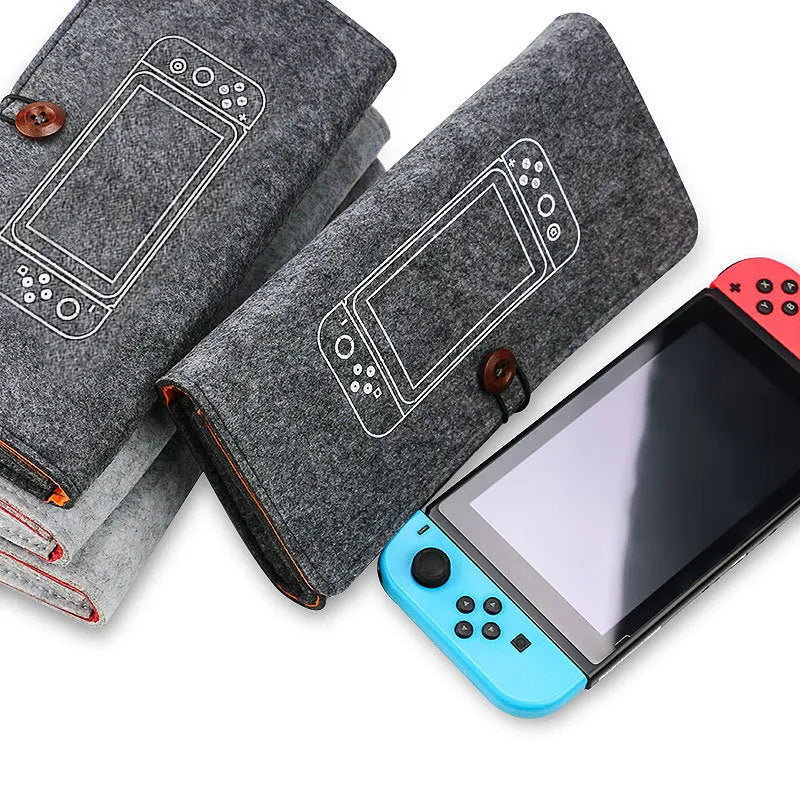 Black felt carrying pouch for Nintendo Switch open to show console compartment and game card slots