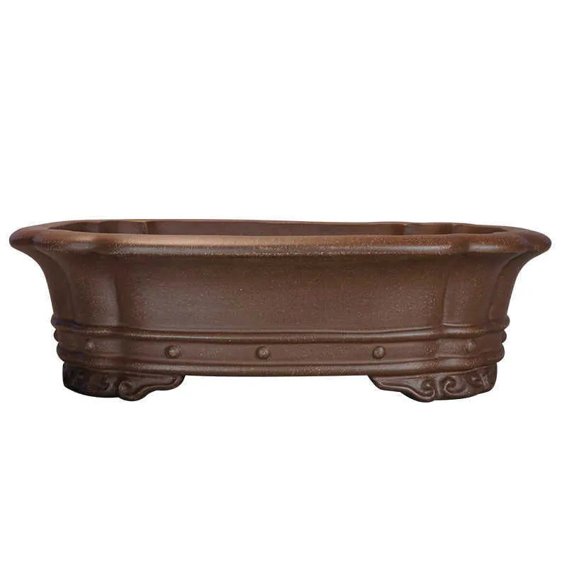 Purple sand handmade rectangular begonia flower pot on a tabletop.