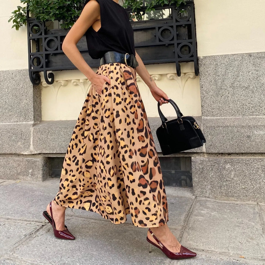 Brown leopard print women's A-line long skirt with elastic waistband laid flat.